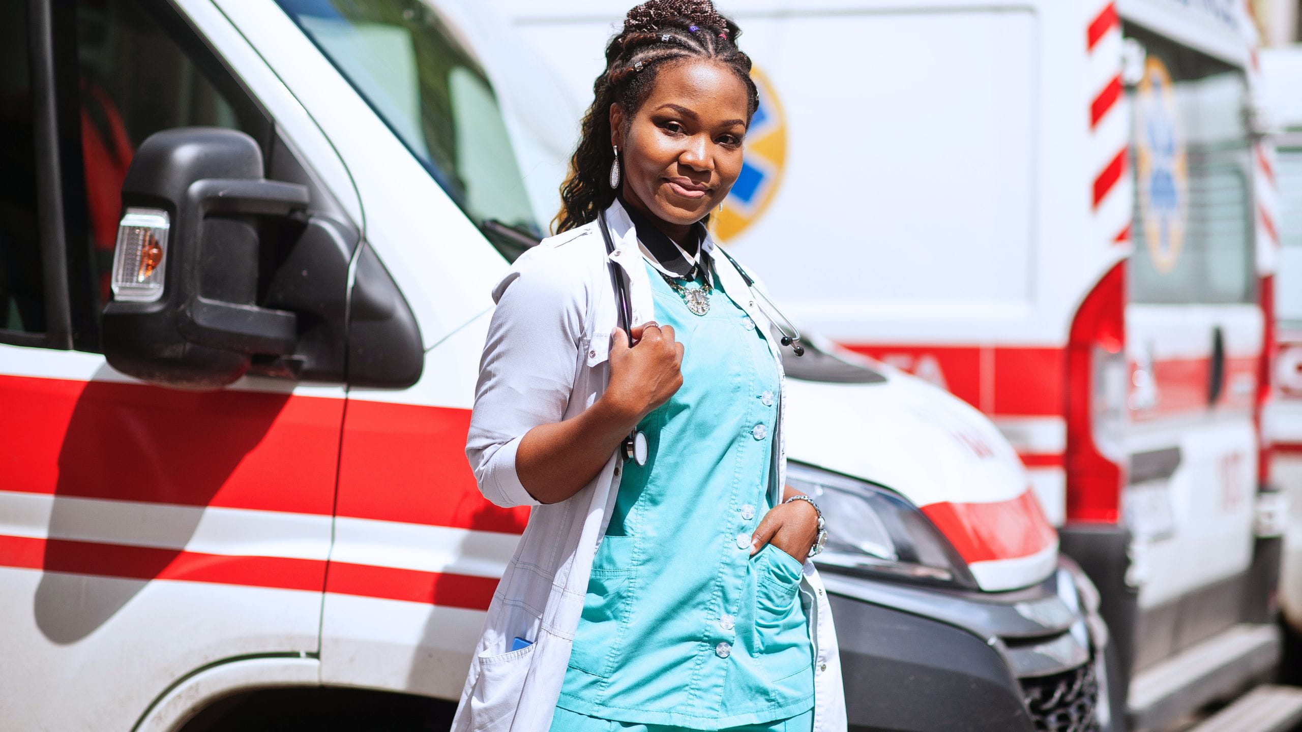Healthcare professional standing beside an ambulance during a major public event